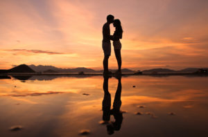two people standing on the beach at sunset the kindness zone making relationships work